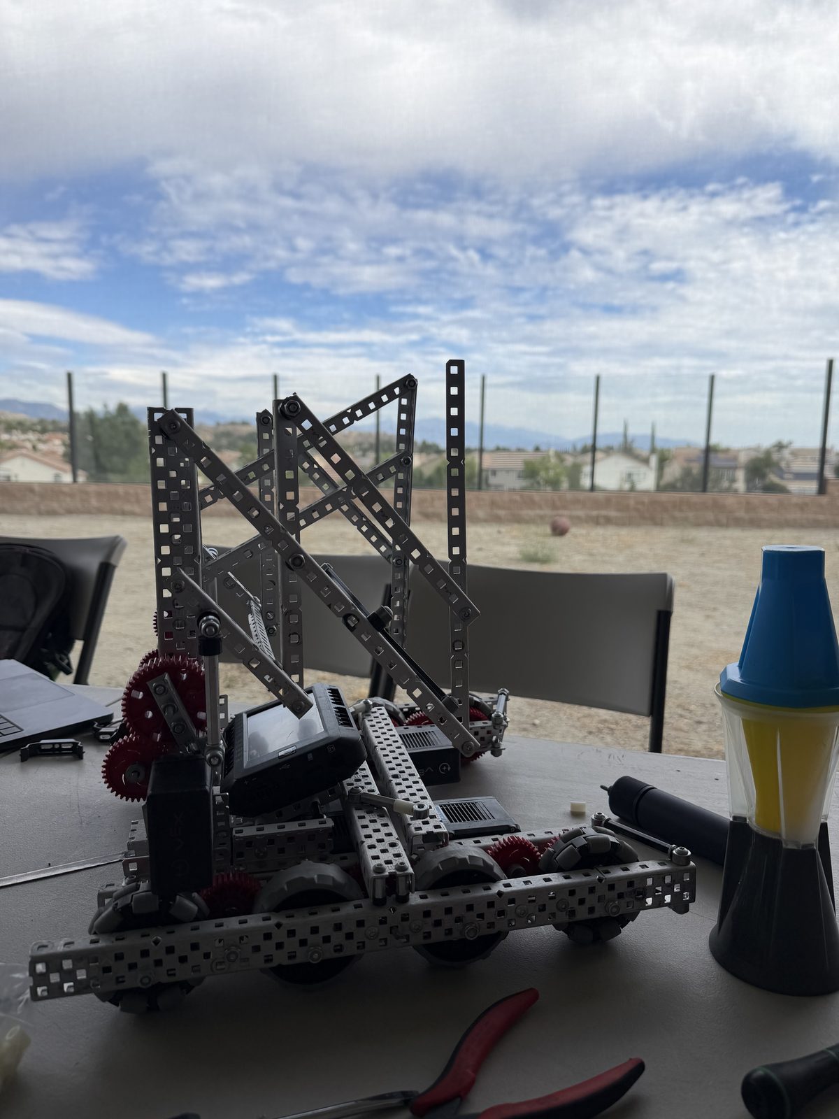 Build stage 1: an early lift frame with crossed uprights test-fit on the robot chassis