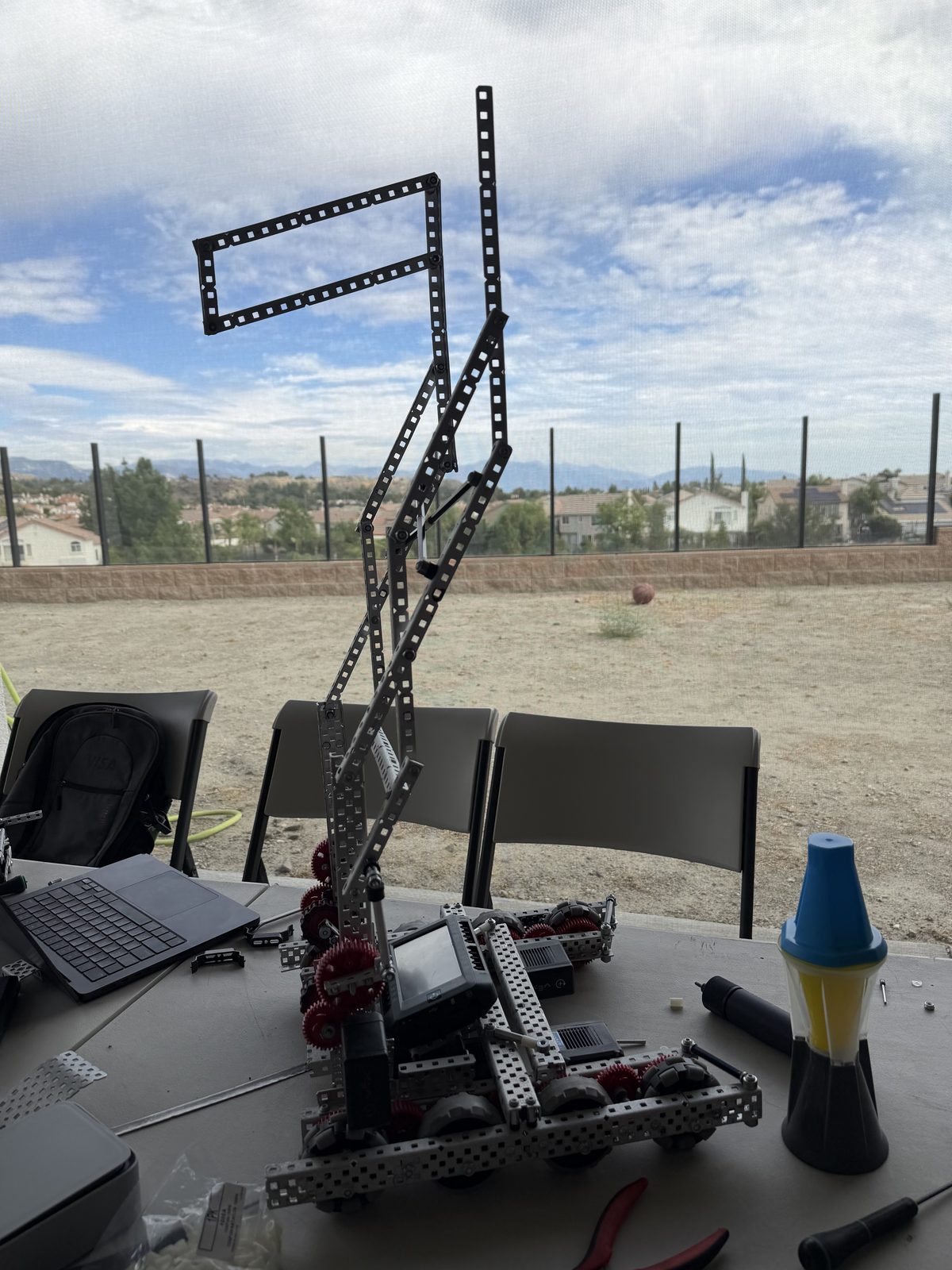 Build stage 3: a taller lift tower with extra diagonal bracing, mid-build